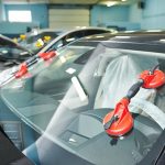 A car windshield being repaired.